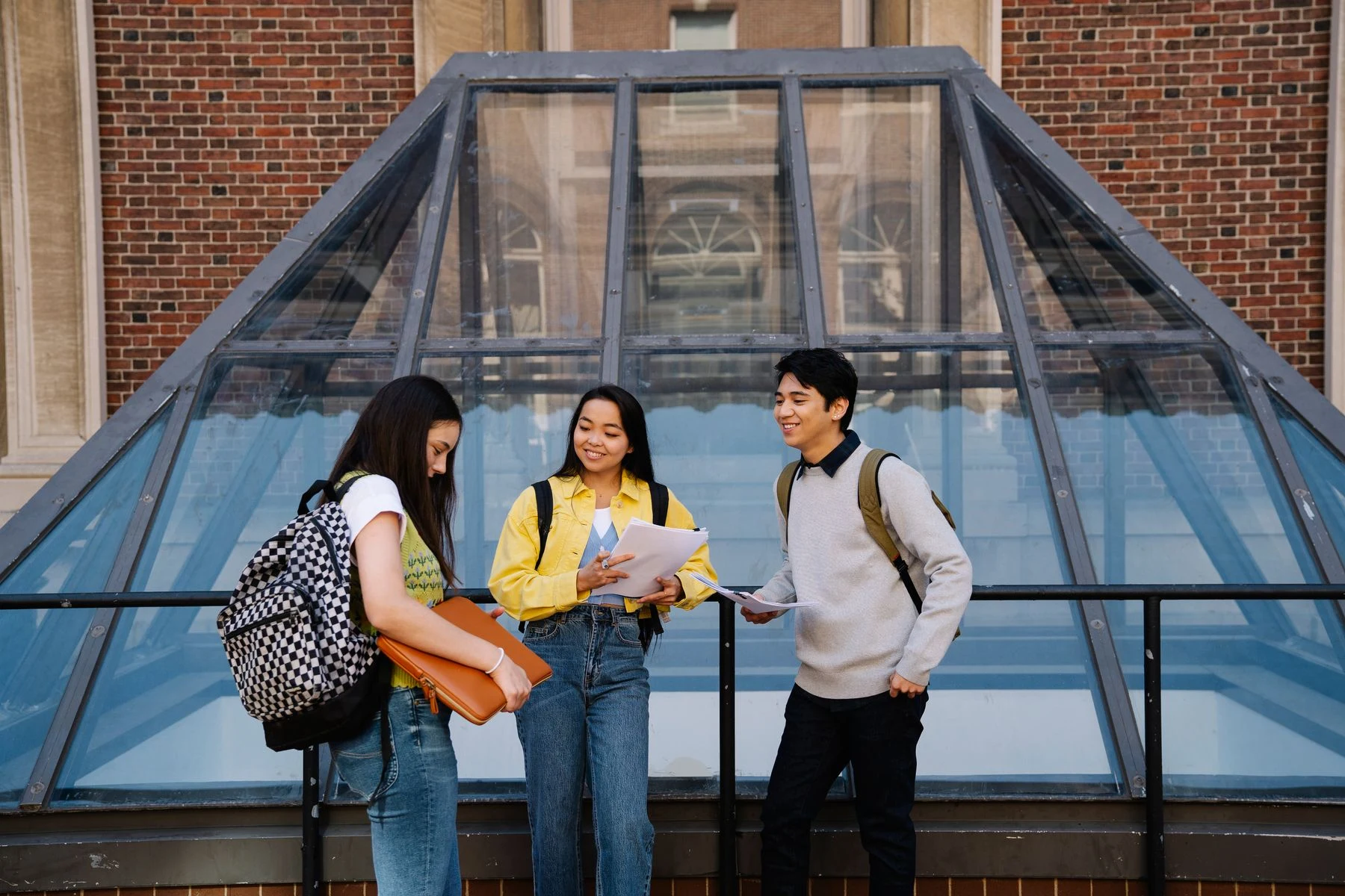 Students discussing their work together on campus