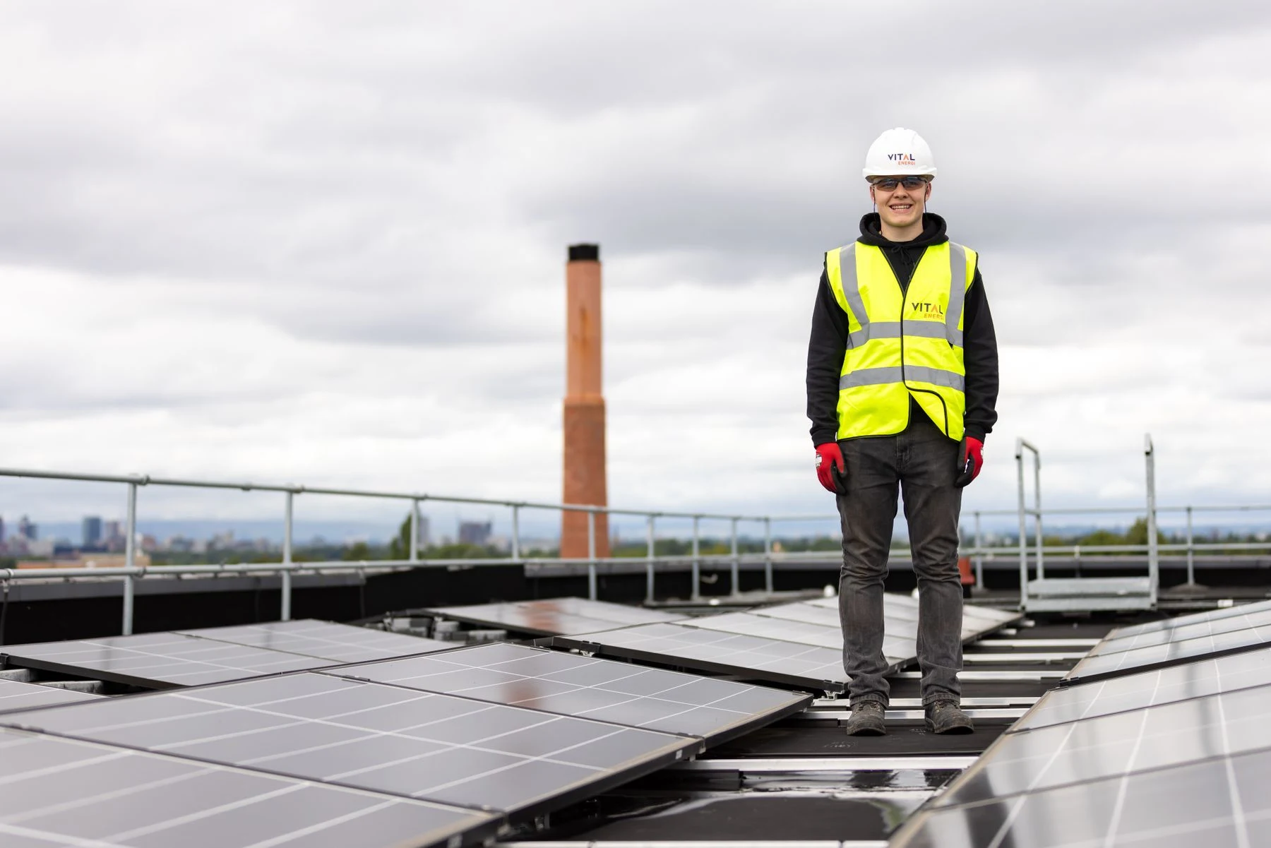 An engineer inspecting a rooftop solar installation